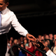 About the only time Obama is without his BlackBerry is during speeches. Here he is handing it to aide Reggie Love.